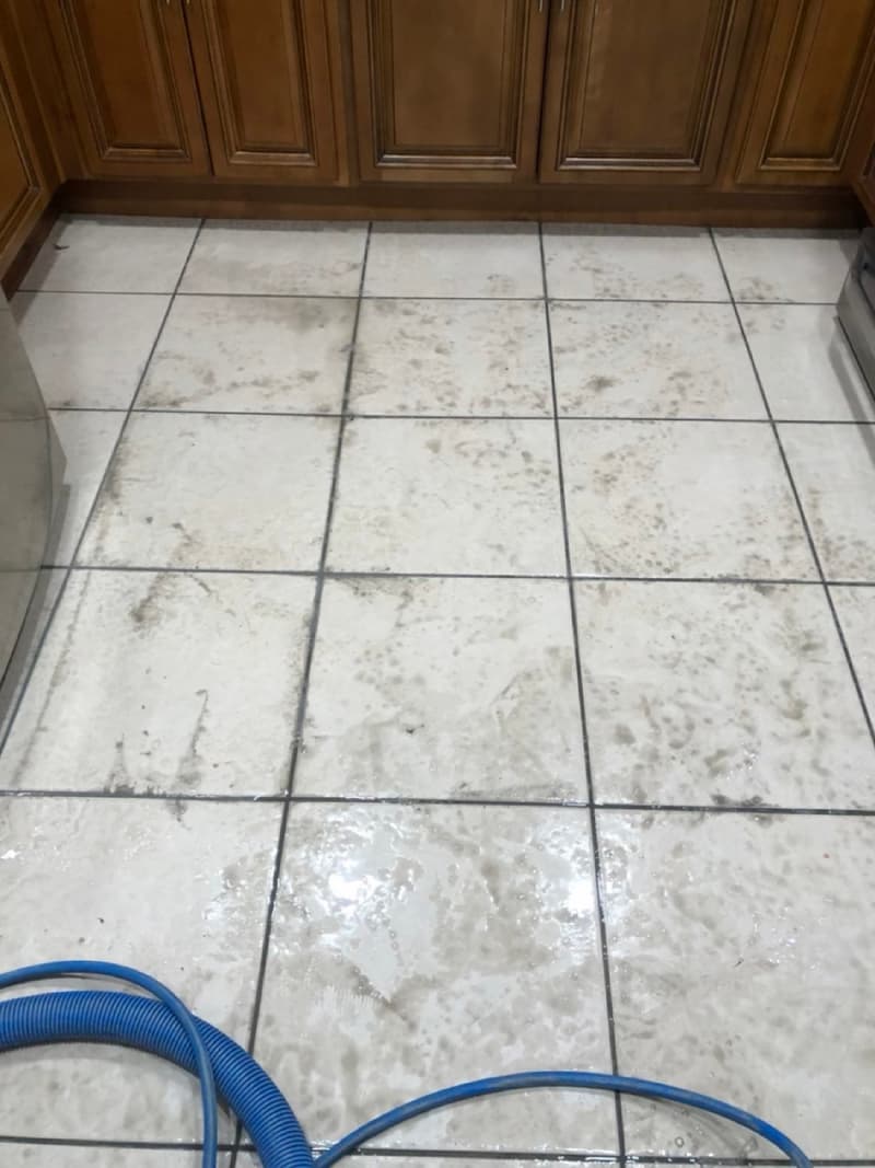 Kitchen tile floor before cleaning