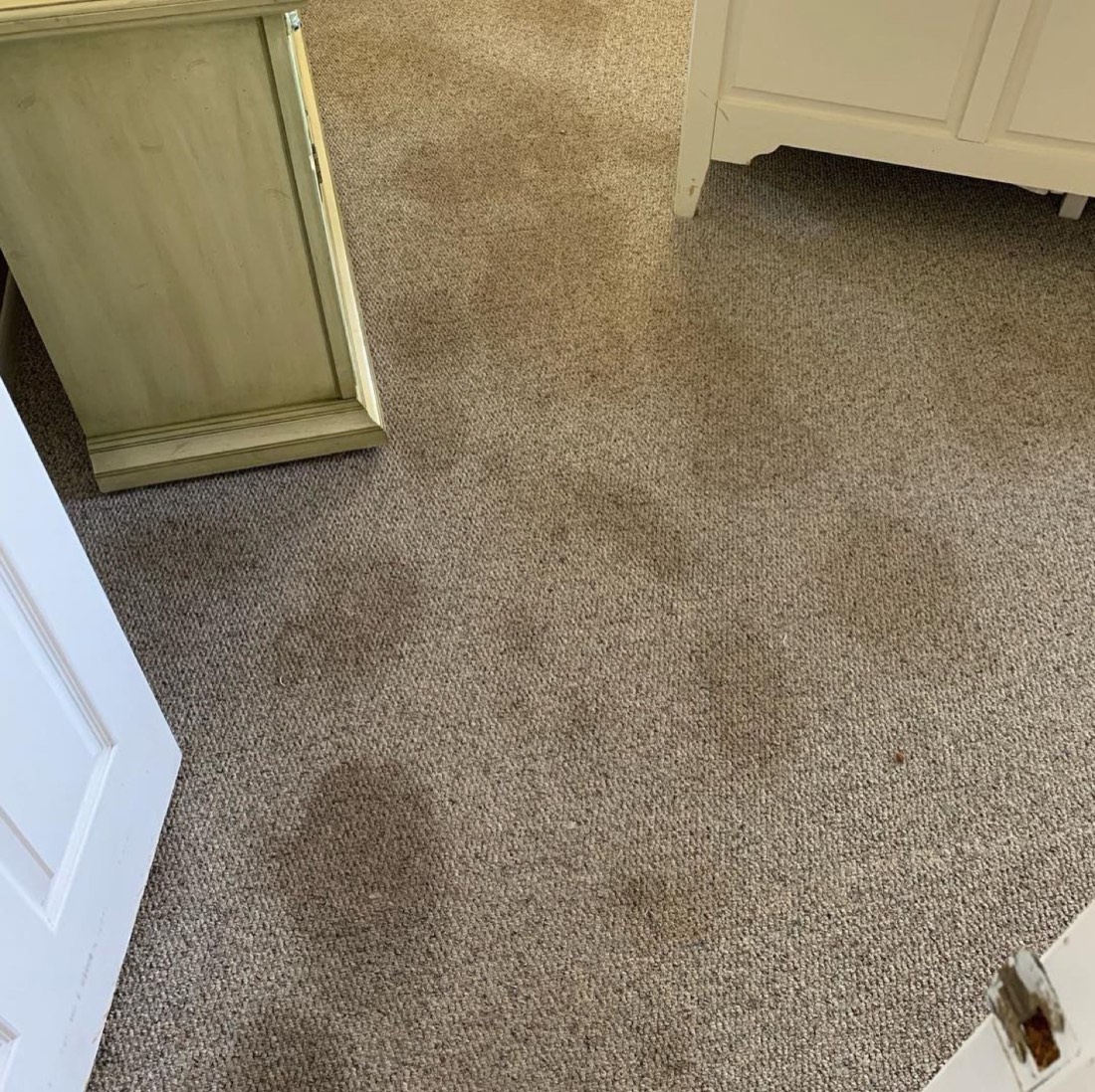 A carpet with stains before cleaning